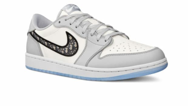 Grey and white Jordan shoe.